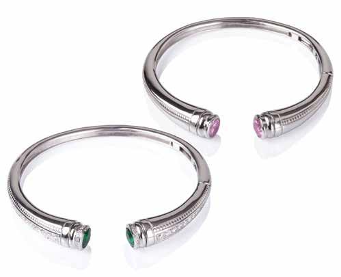 These hinged bracelets are personalized through the choice of end caps that can be removed to secure a lock of hair or a portion of cremated remains.