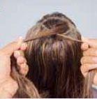 7. Place two outer strands in the left hand, index finger in between