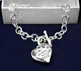 A flexible bangle that has paw prints with the words Opt To Adopt. Child: (B-22-P) Size: 7 1/2 in.