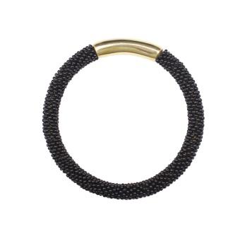 !12 NAEKU BANGLE Hand-cast recycled brass bangle with a herringbone beaded sleeve.
