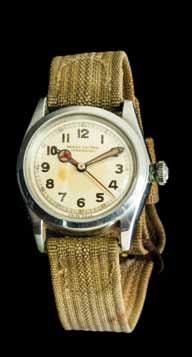 with center hand for chronograph seconds, polished bezel and case, snap on case back, Venus movement, brown leather strap, silver tone buckle. Property from the Collection of Mrs.