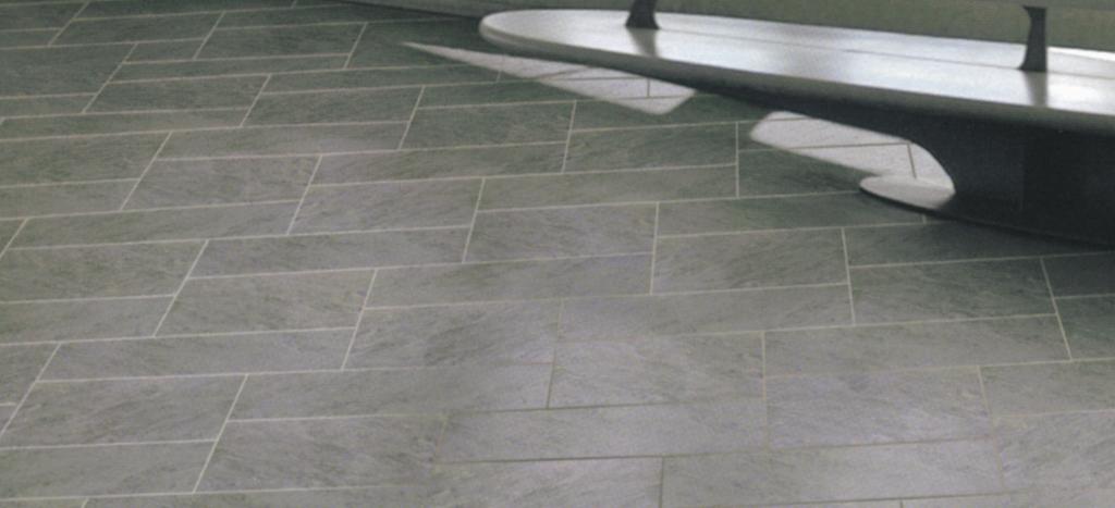 AFTER GROUTING After grouting a light, almost invisible cement film remains on the surface, its strength depending on the surface structure of the tiles.