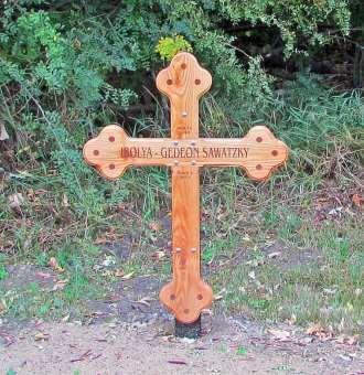 The hand-craftsmanship seen in the wooden cross (south side of cemetery) is unique in local cemeteries.