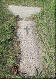 It s not uncommon in this cemetery to see cement grave coverings, usually bearing an additional cross design.