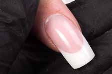 Apply an base layer of clear Fiber Gel over the natural nail and on the form, creating the length and shape of the nail. Cure this layer for 2 minutes.