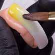the nail. Use the flat side of the brush and apply it like you apply a nail polish.