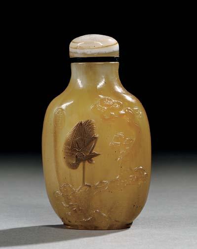 29 30 29 Sandwiched Peking Glass Snuff Bottle, China, Qing dynasty, the flattened oval form on a raised oval foot, the glass swirled in shades of brown to replicate agate, a single glass overlay