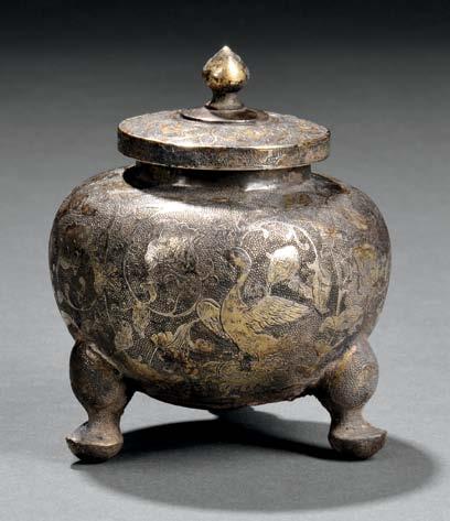 56 57 56 Parcel-gilt Silver Lidded Tripod Jar, China, Tang dynasty, globular, with waisted neck and straight mouth, resting on three cabriole legs, decorated with waterfowl, birds, and flowers
