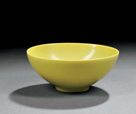 124 125 126 124 Small Yellow-glazed Bowl, China, Qing dynasty, with rounded body and slightly inverted rim, resting on a low