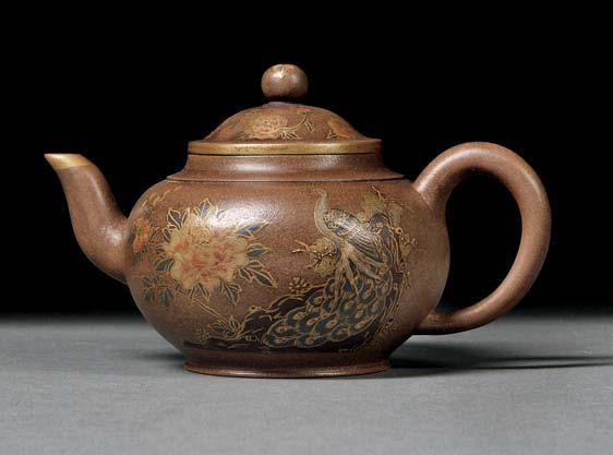 148 148 Yixing Teapot with Gilt Decoration, China, Qing dynasty, compressed globular-shape with a C-shape handle and a spout with gilt tip, resting on a short