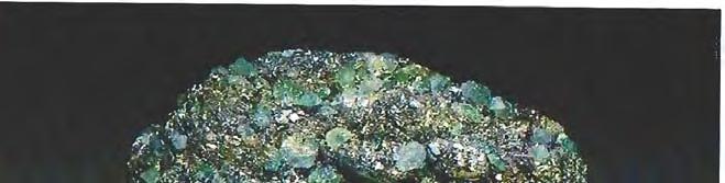 Specimen manufactured out of beryl and pyrite cemented on a base, 78 x 69 x 39 mm. with a fairly diffuse eye. The 13.91- ct stone reportedly came from India.
