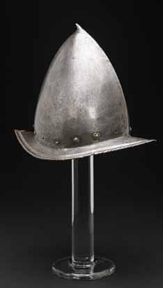 4007 A Spanish, or peaked, morion probably Italian, early 17th century The tall, one-piece almond-shaped skull with slightly curved stalk; lower edge retaining 11 of 14 lining rivets, four of these
