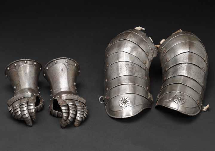 4017 4016 4016 A pair of German fingered gauntlets late 16th/early 17th century Each cuff with median ridge and roped and guttered rim, one with Augsburg pinecone mark; five upward-lapping metacarpal