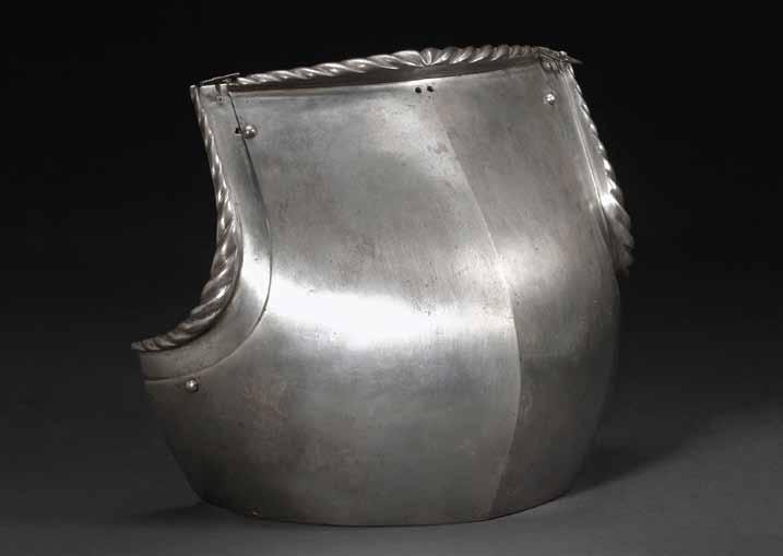 4018 4018 A Gothic breastplate probably German, circa 1520-30 Of short-waisted, globose form with central ridge; upper rim strongly flanged and roped and flanked by steel buckles; strongly roped arm