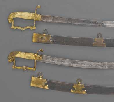 Gilt bronze hilt comprising languets molded with spread eagles, button quillon, scrolling knucklebow molded with foliage and fine open beak eaglehead pommel of so-called screaming eagle type.