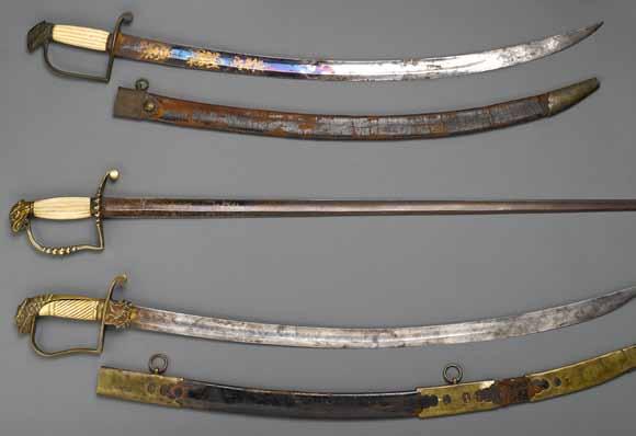 4120 4121 4122 4119 An American eagle pommel officer s saber circa 1805 Curved 30 inch blade with broad, shallow fuller and 12 inch blued panel engraved and gilt with floral panels, one side with