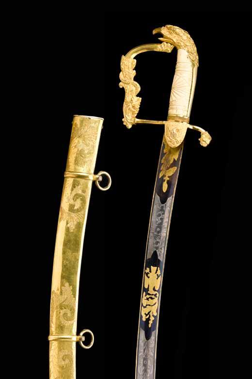 Gilt brass hilt comprising languets molded with Federal eagles; downcurving quillon molded with acanthus; faceted knucklebow boldly molded with an oak branch encircled by a serpent; ferrule molded