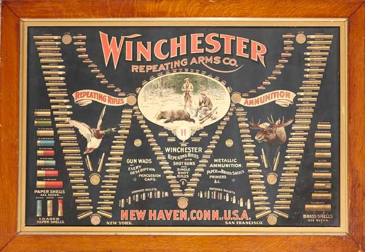 4195 4195 A scarce Winchester Model 1902 cartridge advertising board The lithographic poster form of the double-w cartridge board featuring central vignette of two hunters with dead bear enclosed by