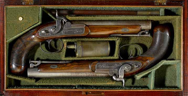 4249 4249 A cased pair of English percussion officer s pistols by Tatham Each with 8 inch round barrel in.65 caliber smoothbore; breeches marked Tatham 37 Charing Cross. Swivel ramrods.