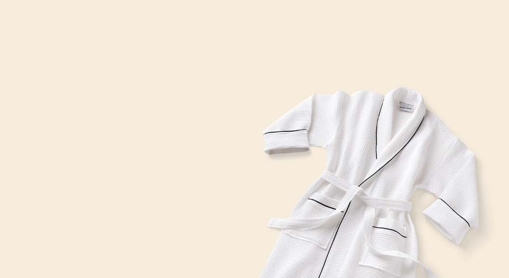shawl waffle Shawl Collar lined waffle robe is 67% cotton 33% poly shell with a 80% cotton 20% poly soft French terry knit lining. 52" length, 22" sleeve length with roll up collar and cuffs.