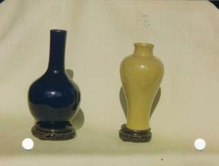 18th/19th c. Porcelain, glazed monochrome dark blue, sacrificial blue. Height 18.5cm/each 14cm. The double-gourd vase underneath polished, underneath of both long-necked vases iron oxide.