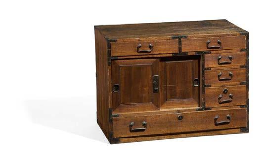 Hidden behind the two doors with a round lock in the upper part two large drawers.