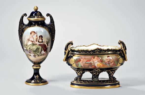 590 589 589 Vienna Porcelain Vase and Cover, early 20th century, urn-form with winged handles, cobalt ground with gilding, polychrome mythological scene of Clotho, gilt-knop lid, footed base,