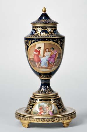 645 647 645 Vienna Porcelain Vase and Cover on Stand, late 19th/early 20th century, each with cobalt ground and gilt jeweling, urn-form vase with polychrome figural mythological scenes in cartouches,