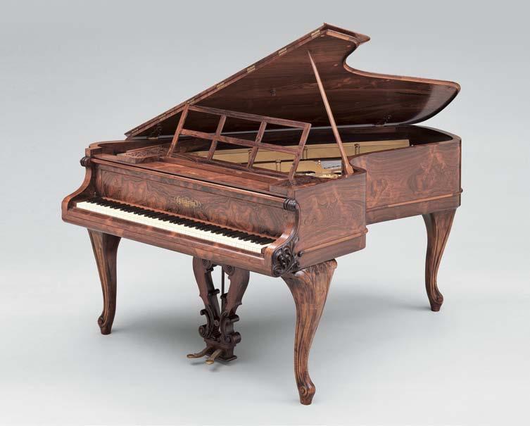 672 672 Chickering and Sons Grand Piano, Boston, 1858, white pine, walnut, and rosewood, eighty-five notes, Rococo Revival decorated surfaces including pedal lyre, fruit and foliage on frame,