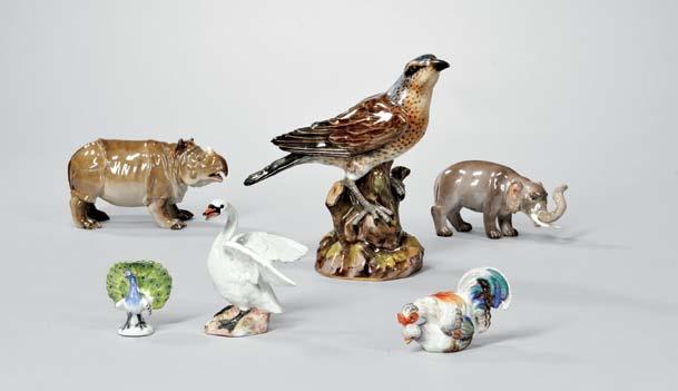 770 768 768 769 769 769 768 Two Meissen Porcelain Animal Figurines, Germany, 20th century, each realistically modeled, with crossed swords mark, a rhinoceros, ht. 3 1/4; and an elephant, ht. 3 in.