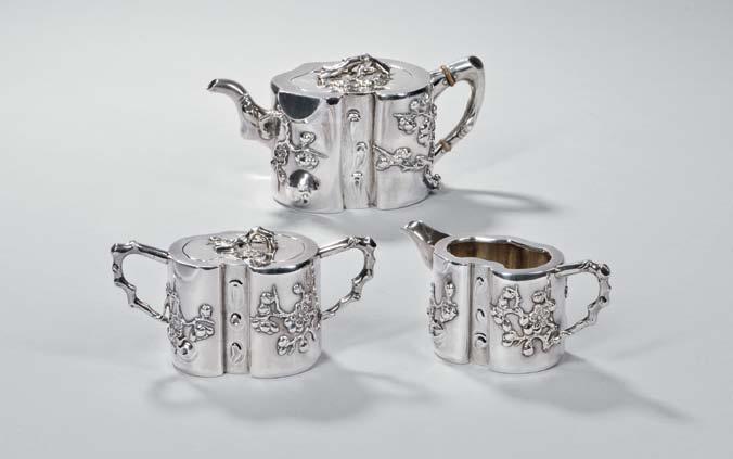 76 73 Two Pieces of Chinese Export Silver Tableware, late 19th/early 20th century, a chalice with engraved dragons to bowl, on tripartite faux-bamboo stem and circular foot, maker s mark WSL, ht.