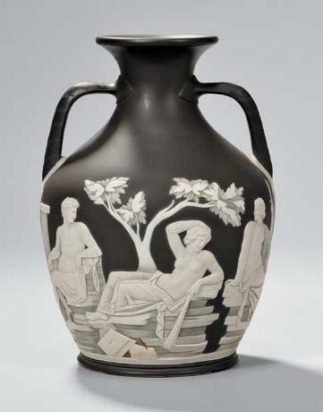 mark, ht. 24 1/2 in. $4,000-6,000 309 Three Wedgwood Black Jasper Dip Items, England, 19th century, each with applied white classical figures in relief, a tall jug with fruiting grapevine border, ht.