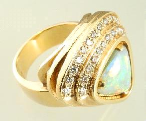 $4,000 - $6,000 466 467 468 469 470 Lot # 452 452 14k yellow gold opal and diamond ring.