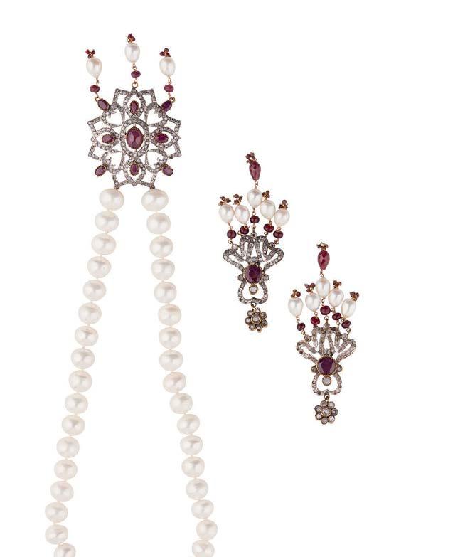 ruby bead pendants; the earrings of similar design, stamped 925 (2) Length of necklace: 50cm, length of earrings: 10cm 1,000-1,500 18 HC936/4 An Indian Art Deco