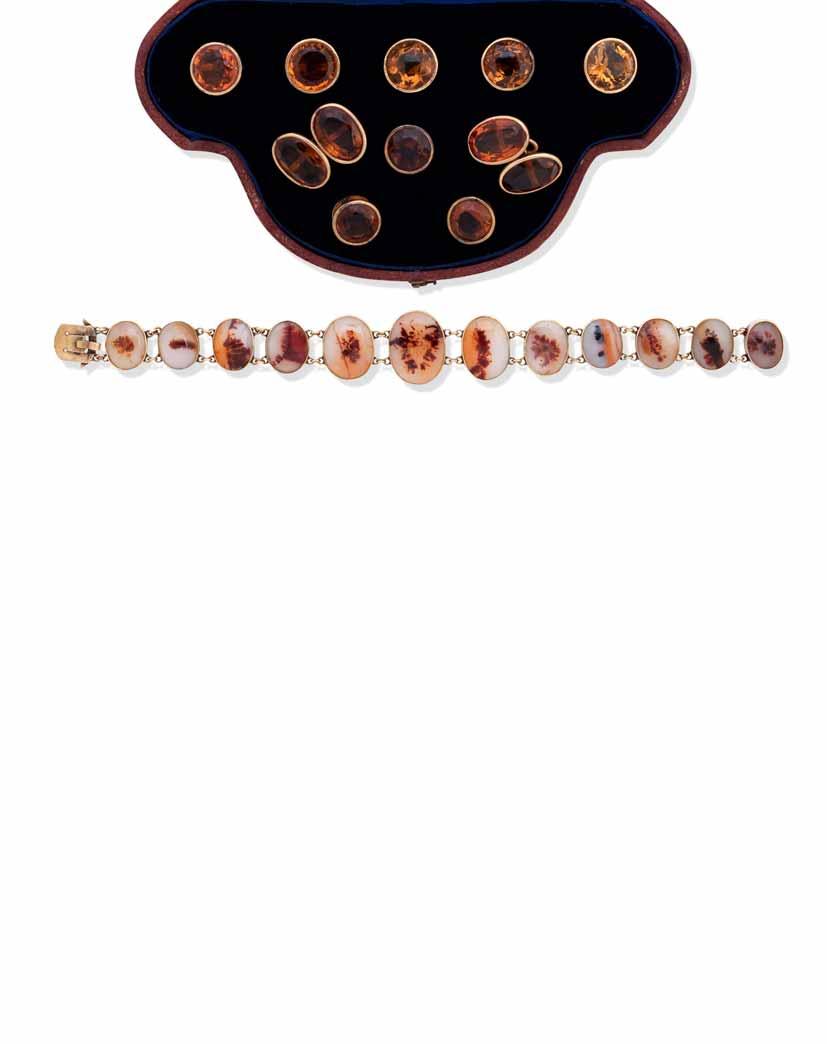 37 38 37 A GENTLEMAN S CITRINE DRESS STUD SET Comprising: five buttons, three studs and a pair of cufflinks, set with circular-cut citrines to the buttons and studs and oval-cut citrines to the