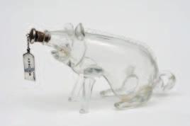 321 322 325 326 321 A novelty whisky decanter in the form of a pig the animal in seated posture with Elkington & Co.