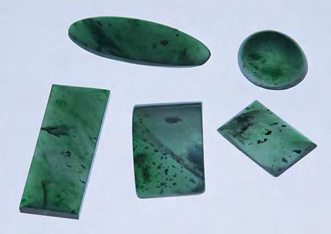 Figure 10. Olmec Imperial jadeite (here, 1.89 5.51 ct) is strongly saturated bluish green in transmitted light. Courtesy of Ventana Mining Co.; photo by Maha Tannous.