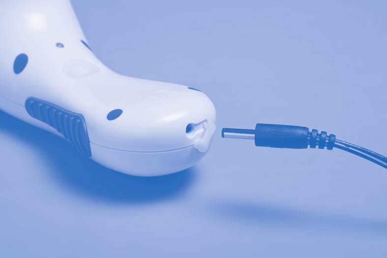 Charging Using the "lift tab" on the waterproof silicone cover located on the base of the SonicDermabrasion handle, lift and open to insert connector into opening and plug Charger Cord into wall