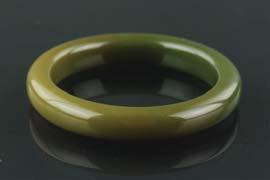 orchid and lotus in low relief on body; H: 8 cm, W: 5 cm, 110 87 Chinese Brown Hardstone Bangle