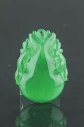 Page: 17 159 Chinese Emerald Green Jadeite Pendant Chinese emerald green jadeite pendant; featuring two beast resting on