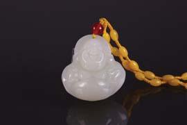 Page: 22 209 Chinese Fine White Jade Carved Buddha Chinese fine white jade carved Buddha pendant; featuring laughing Buddha; pierced for