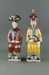standing on lotus plinth; covered with white glaze; Dehua mark and four-character artist mark on back; H: 35 cm, W: 11