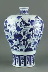 Qianlong period; of Hu vase form with double elephant-shaped handles on shoulder; decorated with two bands of scrolling