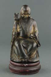 in Vitarka Mudra; wood stand included; H: 15 cm, W: 9 cm, 757 439 Chinese Gilt Bronze