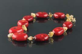 Page: 47 456 Tibet Red Coral w/ Amber Necklace Tibetan coral necklace; comprised of red coral barrel