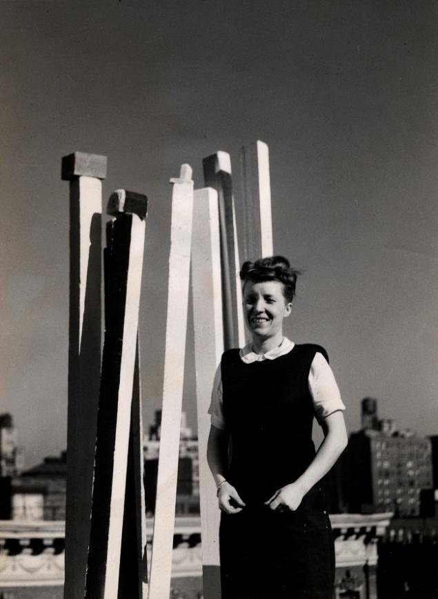 About the Artist Louise Bourgeois with her sculpture on the roof of her apartment building in NYC, mid-1940s.