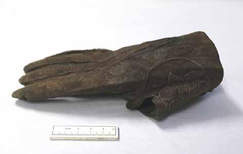 Figure 86 Leather glove from the moat backfills A series of extremely organic deposits were documented in trench Z 3465 in 2011, stratigraphically and physically under the late 17 th century