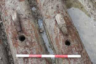 The cut was made through the foundations of the former medieval gateway, which shows that this was surely demolished by this time as the level of truncation caused by the waterpipe trench was quite