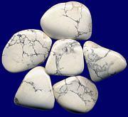 Howlite Hyalite Opal Iolite White with black or gray veins running through the white. Hyalite is a white transparent opal that reflects the entire color spectrum.