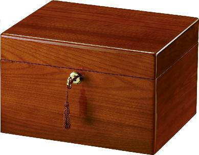 The Howard Miller Collection Devotion Series 248 This collection of memorial chests features a high-gloss finish on solid